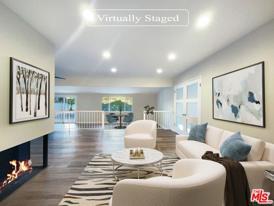 7944 Limerick Avenue Winnetka, CA 91306 - Photo 2 of 23 a living room with furniture and a flat screen tv