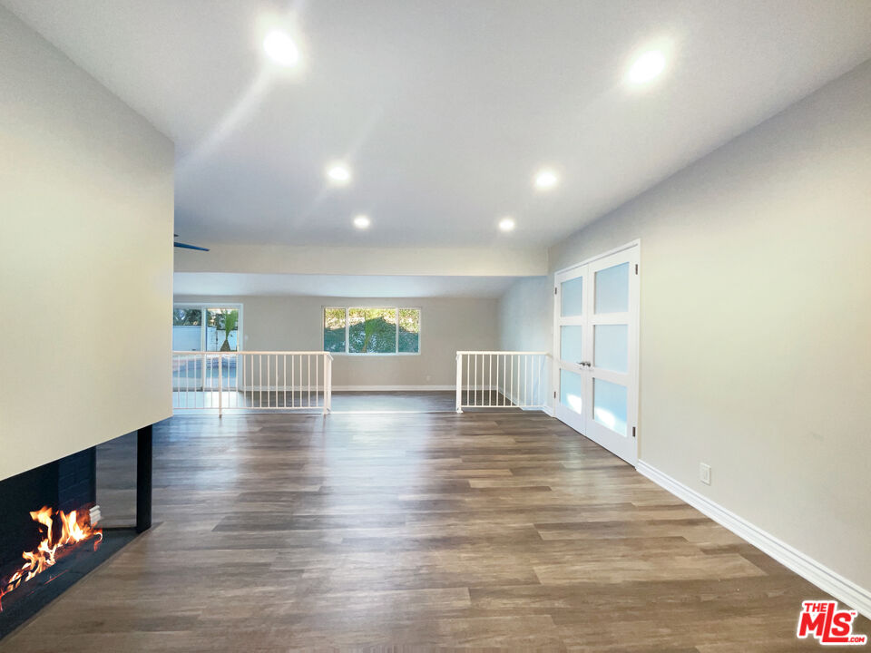 7944 Limerick Avenue Winnetka, CA 91306 - Photo 3 of 23 a view of empty room with wooden floor