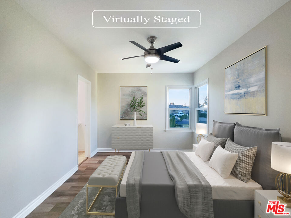 7944 Limerick Avenue Winnetka, CA 91306 - Photo 4 of 23 a bedroom with a bed and a window