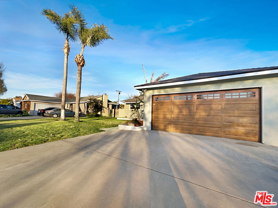 7944 Limerick Avenue Winnetka, CA 91306 - Photo 9 of 23 a view of a house with a yard