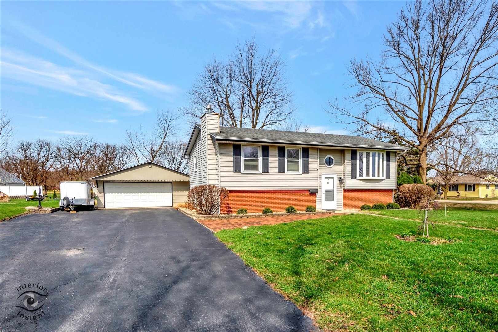 589 South Walnut Street Chebanse, IL 60922 - Photo 2 of 25 a front view of a house with a yard table and chairs