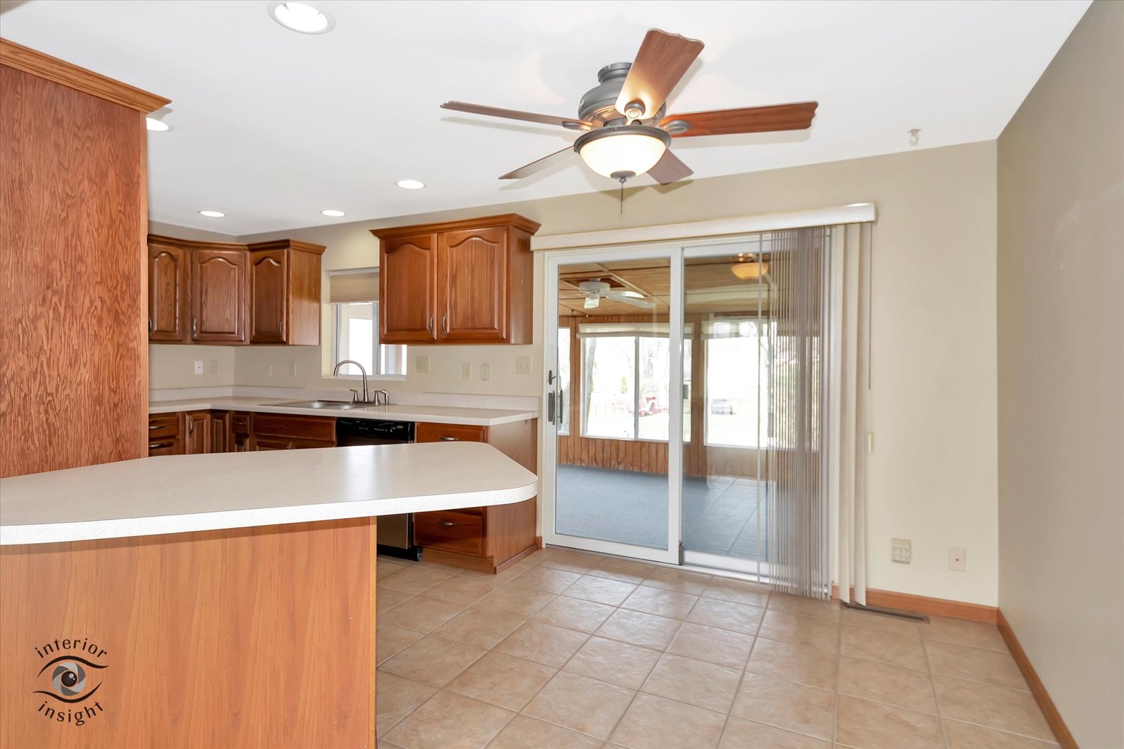 589 South Walnut Street Chebanse, IL 60922 - Photo 6 of 25 a large kitchen with kitchen island a large window a sink and stainless steel appliances