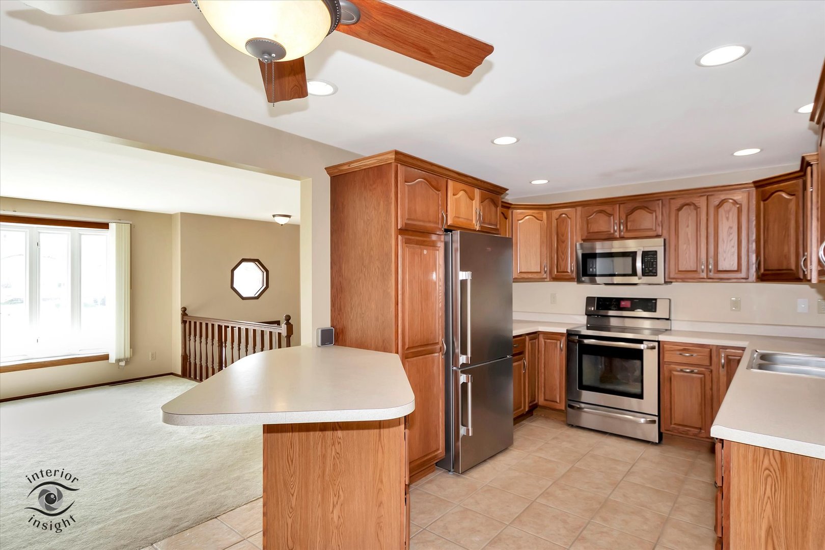 589 South Walnut Street Chebanse, IL 60922 - Photo 7 of 25 a kitchen with stainless steel appliances granite countertop a refrigerator a stove a sink and a microwave