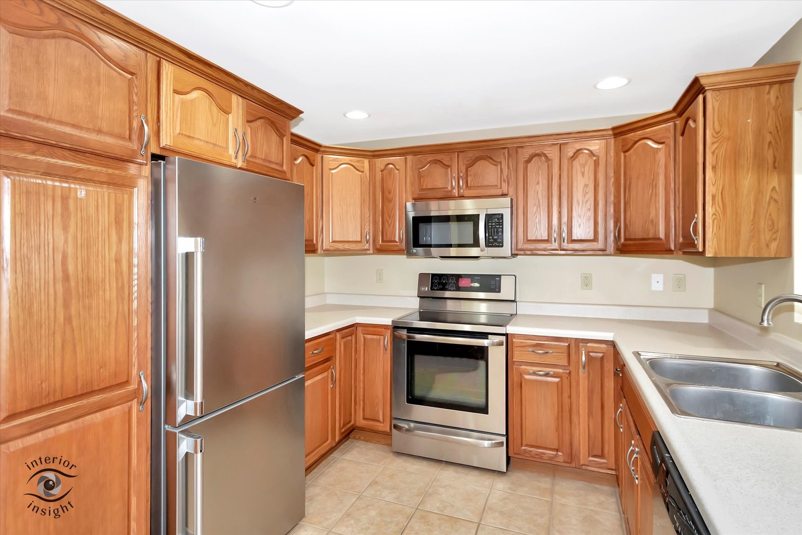 589 South Walnut Street Chebanse, IL 60922 - Photo 8 of 25 a kitchen with stainless steel appliances granite countertop a refrigerator stove and sink