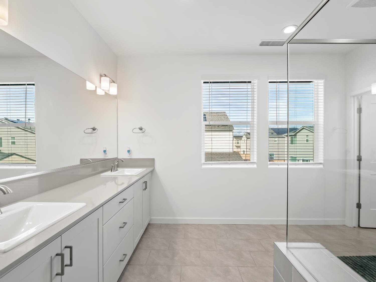 4071 Braden Road Madera, CA 93636 - Photo 21 of 31 a spacious bathroom with a granite countertop sink mirror and double