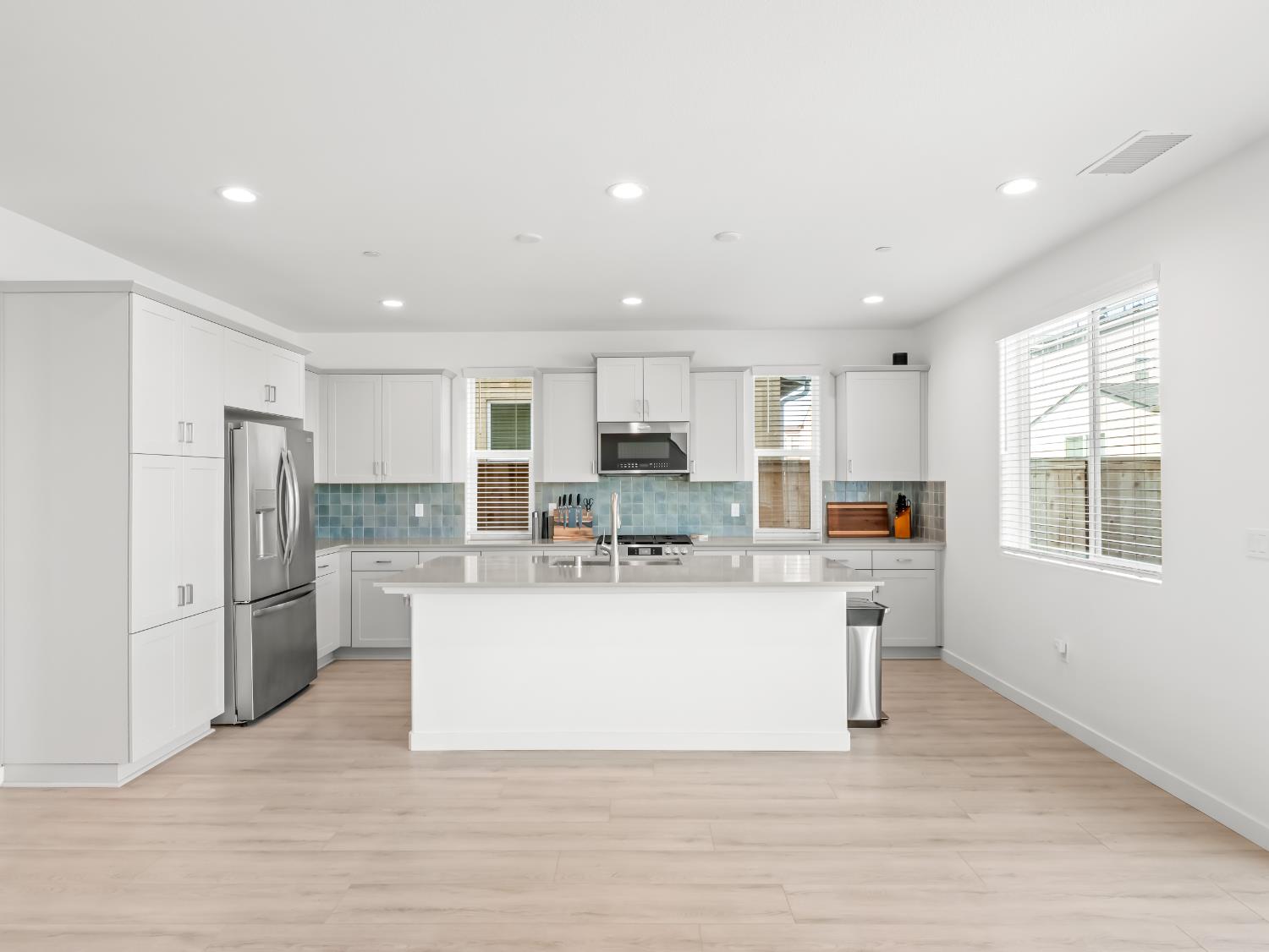 4071 Braden Road Madera, CA 93636 - Photo 7 of 31 a view of kitchen with stainless steel appliances refrigerator stove microwave and cabinets