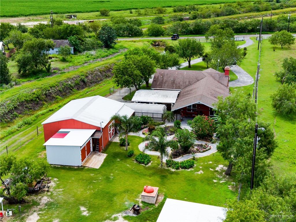 22172 North Olmito Road Rio Hondo, TX 78583 - Photo 22 of 33 an aerial view of a house with pool outdoor seating and yard