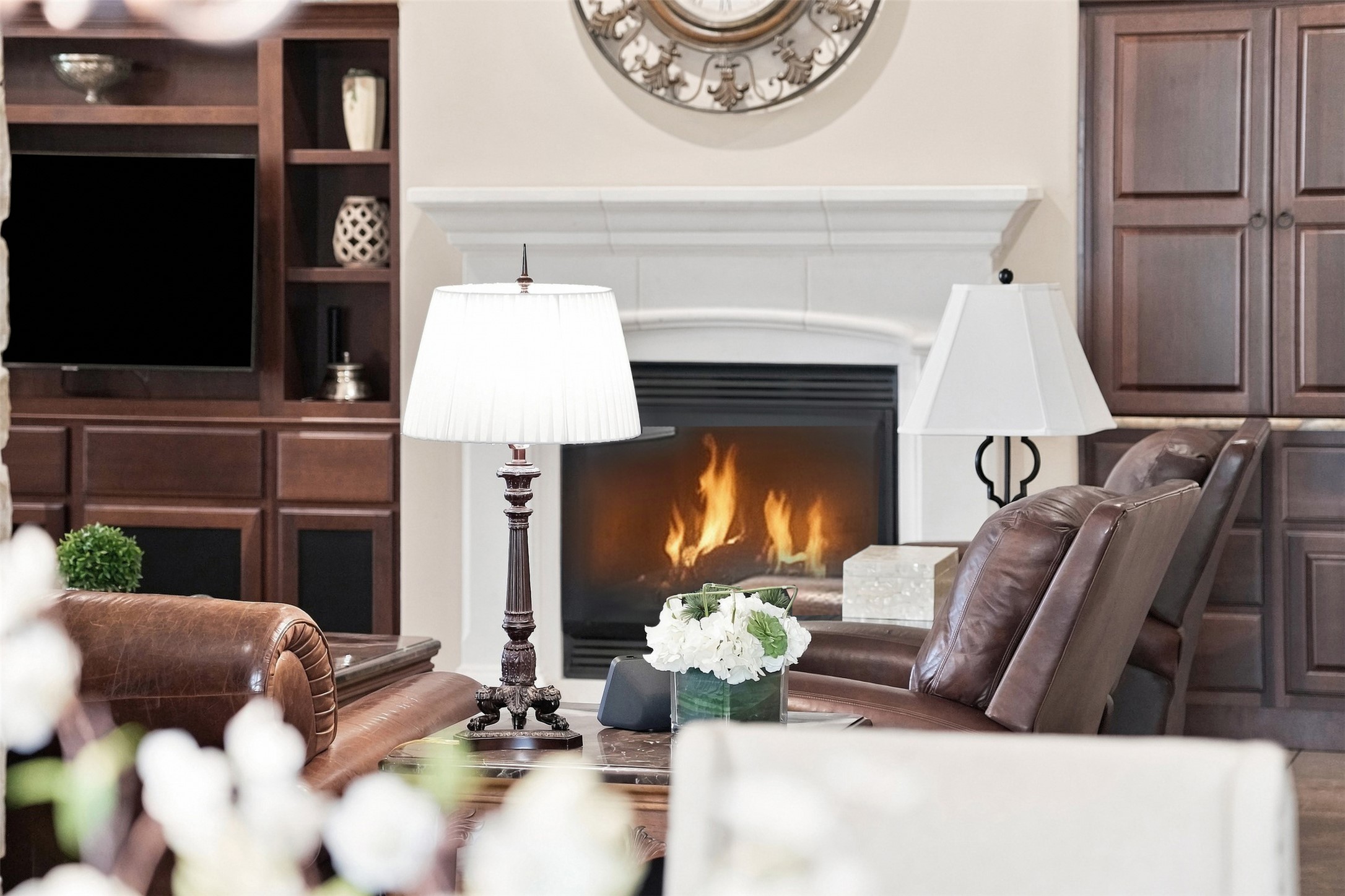 402 Ridgetop Bend Cedar Park, TX 78613 - Photo 12 of 40 Rich wood built-ins and a classic white fireplace anchor this inviting living space.