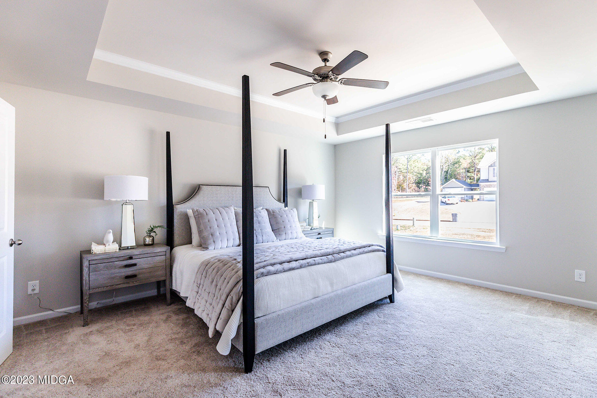 118 Red Birch Lane Warner Robins, GA 31093 - Photo 13 of 19 a bed room with a bed and a chandelier