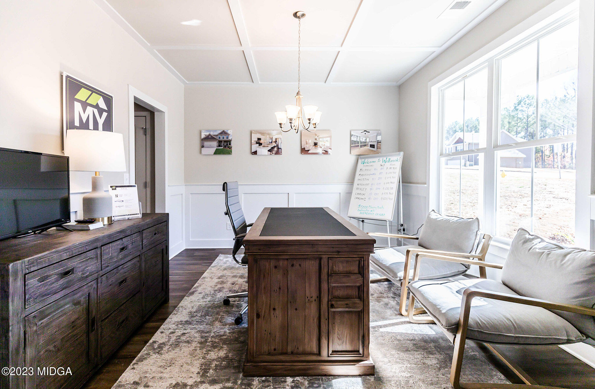 118 Red Birch Lane Warner Robins, GA 31093 - Photo 6 of 19 a living room with furniture a chandelier and a flat screen tv