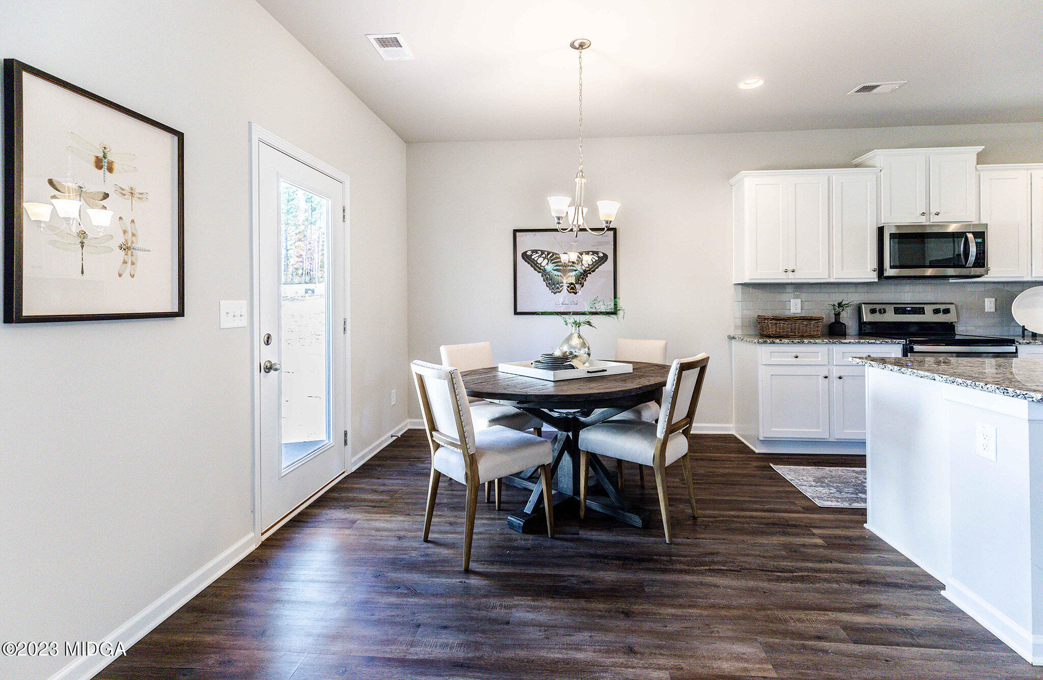 118 Red Birch Lane Warner Robins, GA 31093 - Photo 9 of 19 a view of a dining room with furniture and wooden floor