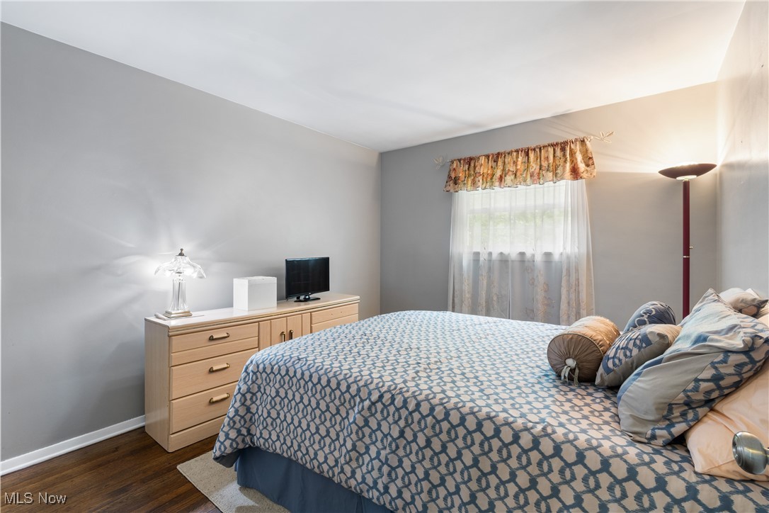 6751 Glenview Road Cleveland, OH 44143 - Photo 17 of 31 Bedroom with dark wood finished floors and baseboards