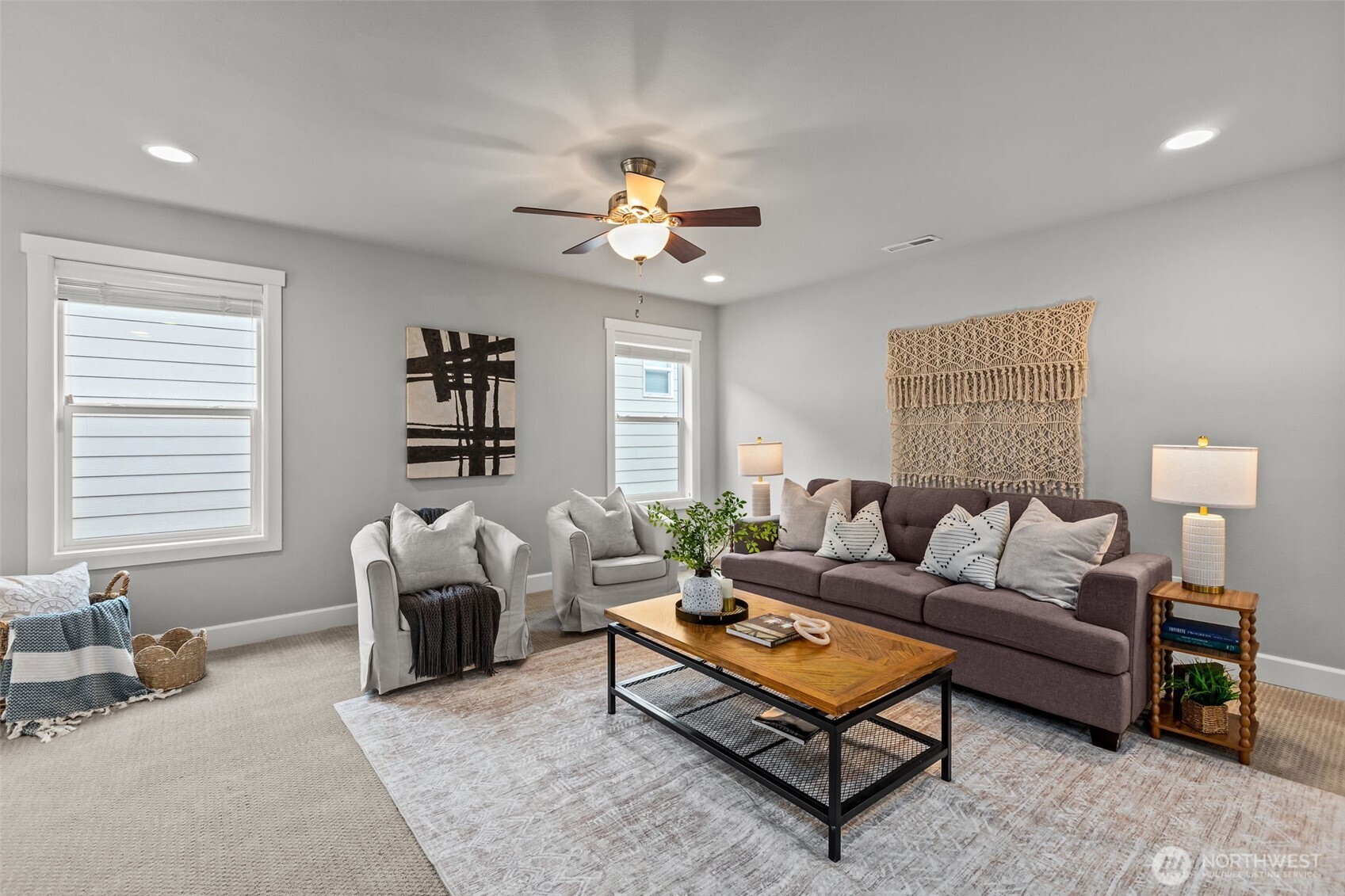 18231 3rd Drive Southeast Bothell, WA 98012 - Photo 20 of 40 a living room with furniture a rug and a chandelier