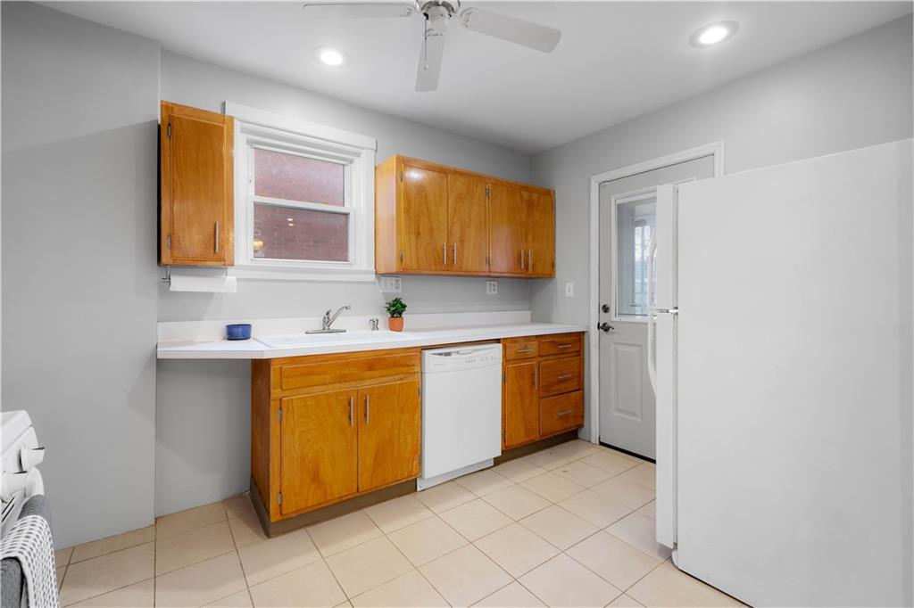 86 Duncan Avenue Pittsburgh, PA 15205 - Photo 11 of 30 a kitchen with stainless steel appliances granite countertop a sink and a cabinets
