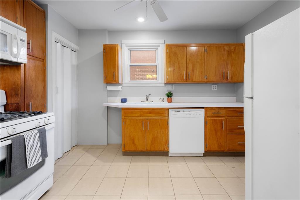 86 Duncan Avenue Pittsburgh, PA 15205 - Photo 12 of 30 a utility room with a sink a washer and dryer