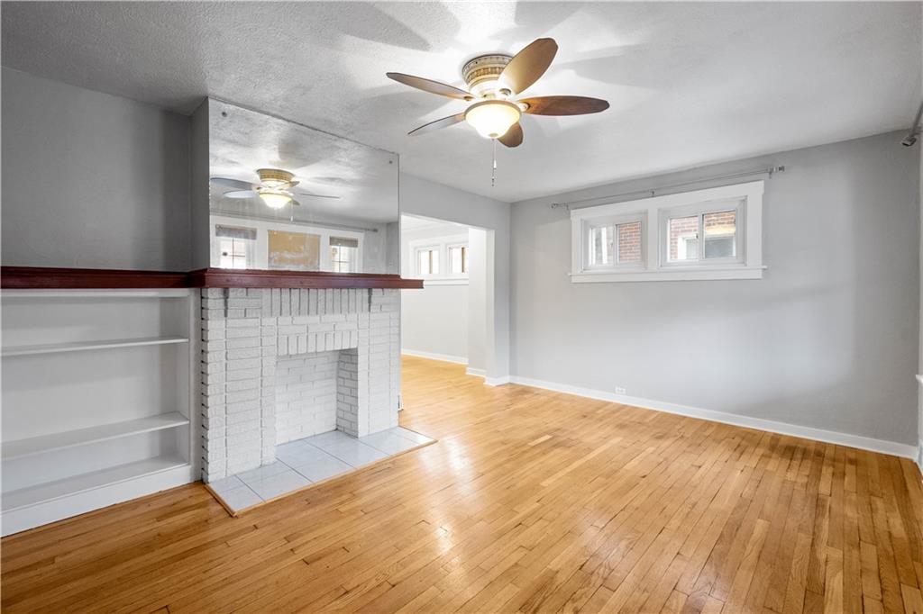 86 Duncan Avenue Pittsburgh, PA 15205 - Photo 3 of 30 a view of an empty room with wooden floor and a window