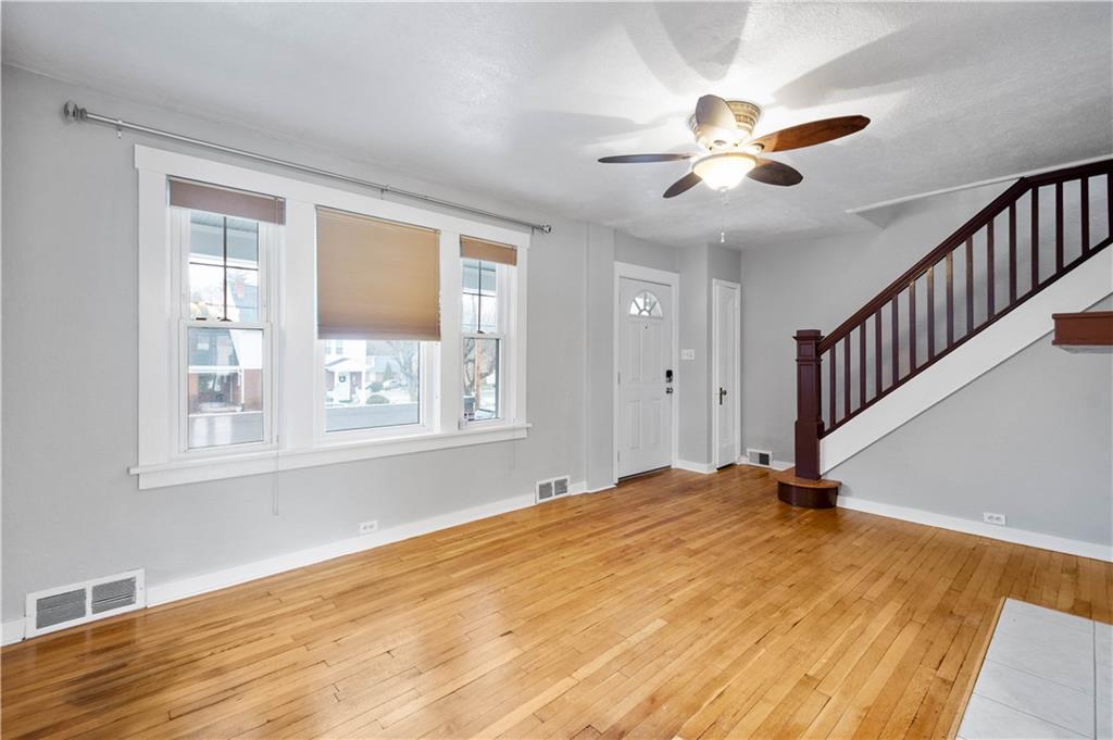 86 Duncan Avenue Pittsburgh, PA 15205 - Photo 4 of 30 a view of an empty room with wooden floor and a window