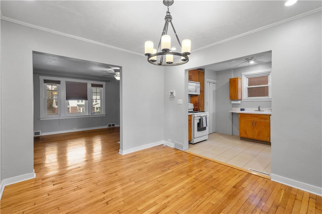 86 Duncan Avenue Pittsburgh, PA 15205 - Photo 6 of 30 a view of a kitchen with a dishwasher cabinets and wooden floor