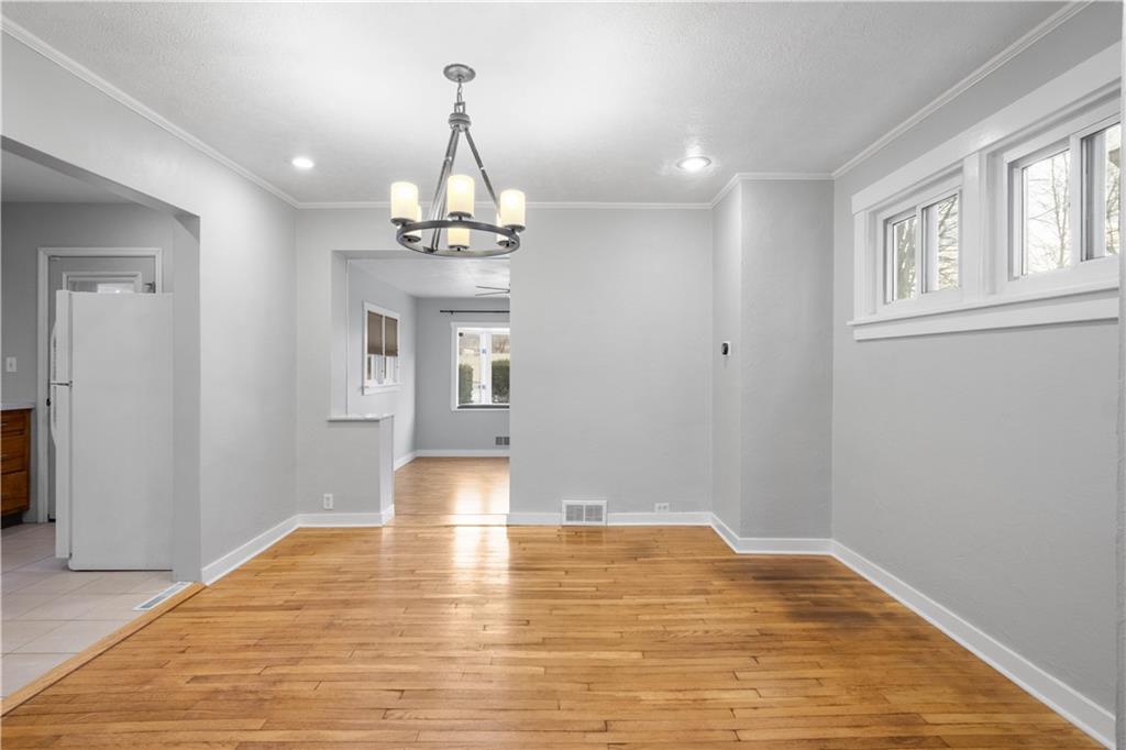 86 Duncan Avenue Pittsburgh, PA 15205 - Photo 7 of 30 a view of a room with wooden floor and chandelier