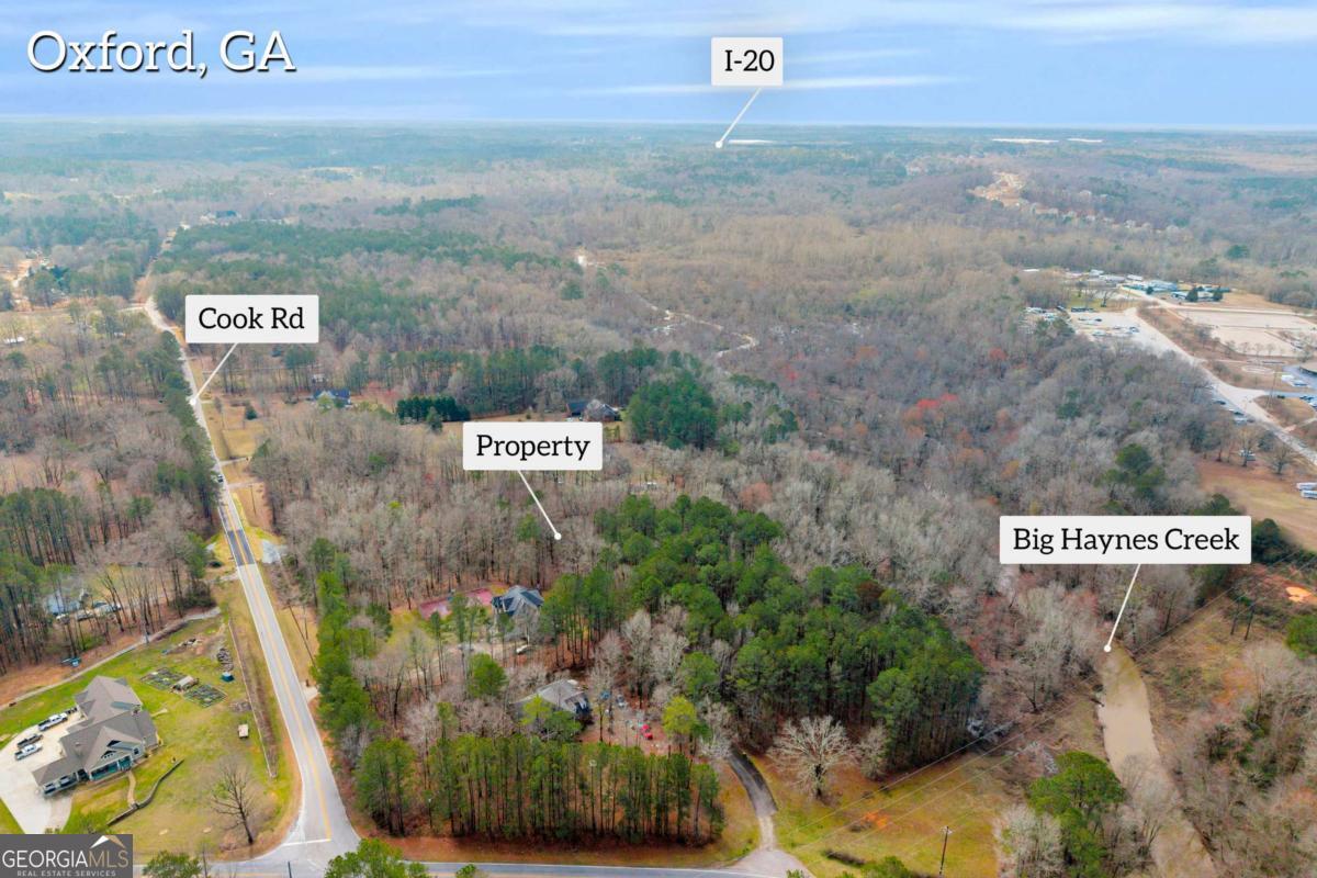 0 Cook Road, Unit LOT 26 Oxford, GA 30054 - Photo 5 of 11 a view of outdoor space with signage and flags