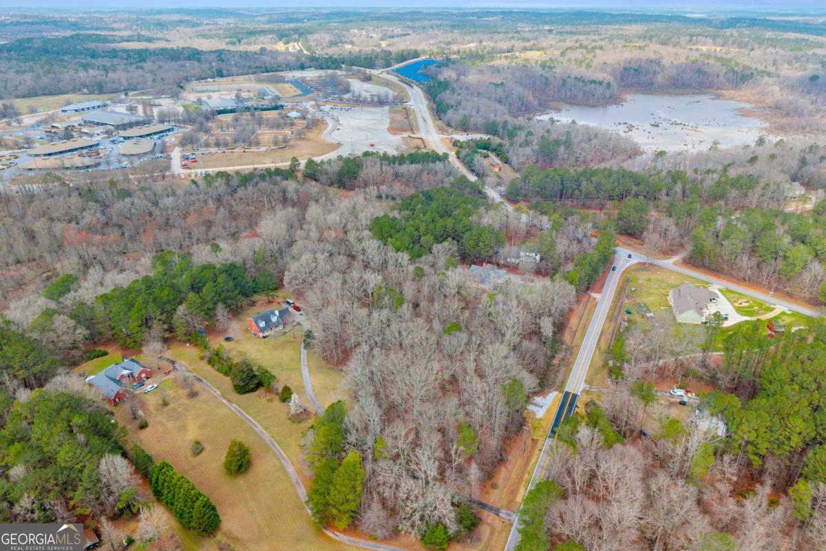 0 Cook Road, Unit LOT 26 Oxford, GA 30054 - Photo 7 of 11 an aerial view of residential houses with outdoor space