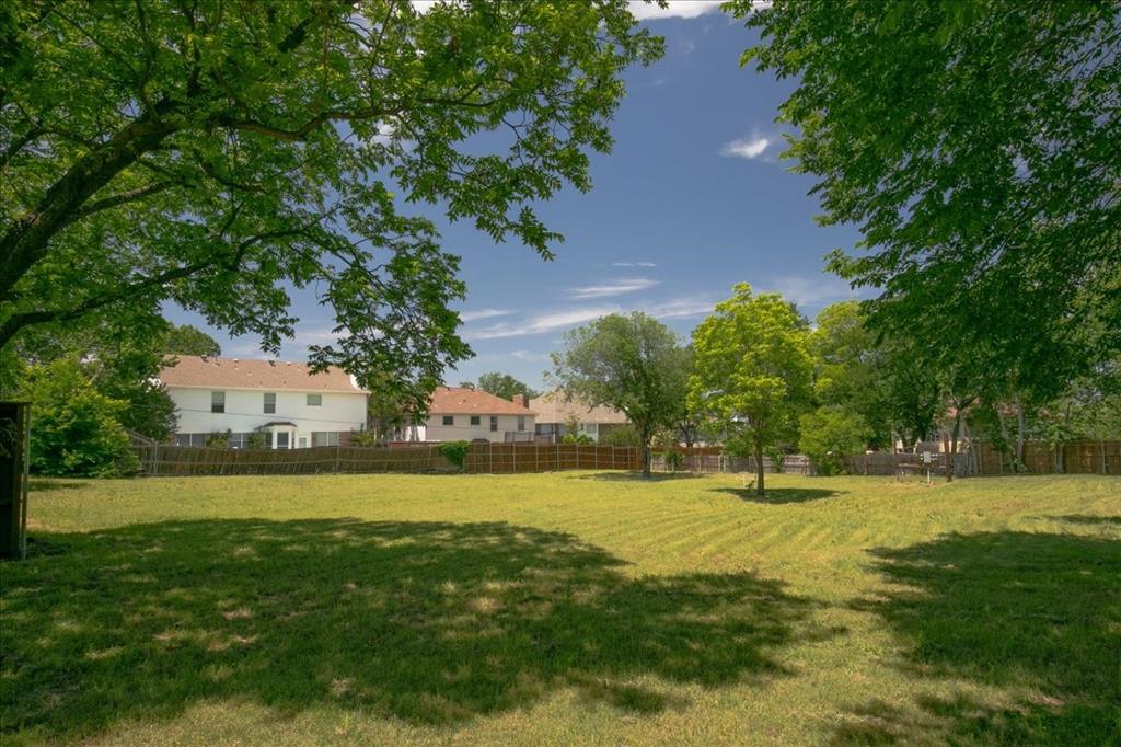 1000 Hughes Road Grapevine, TX 76051 - Photo 9 of 15 a view of a big yard with large trees