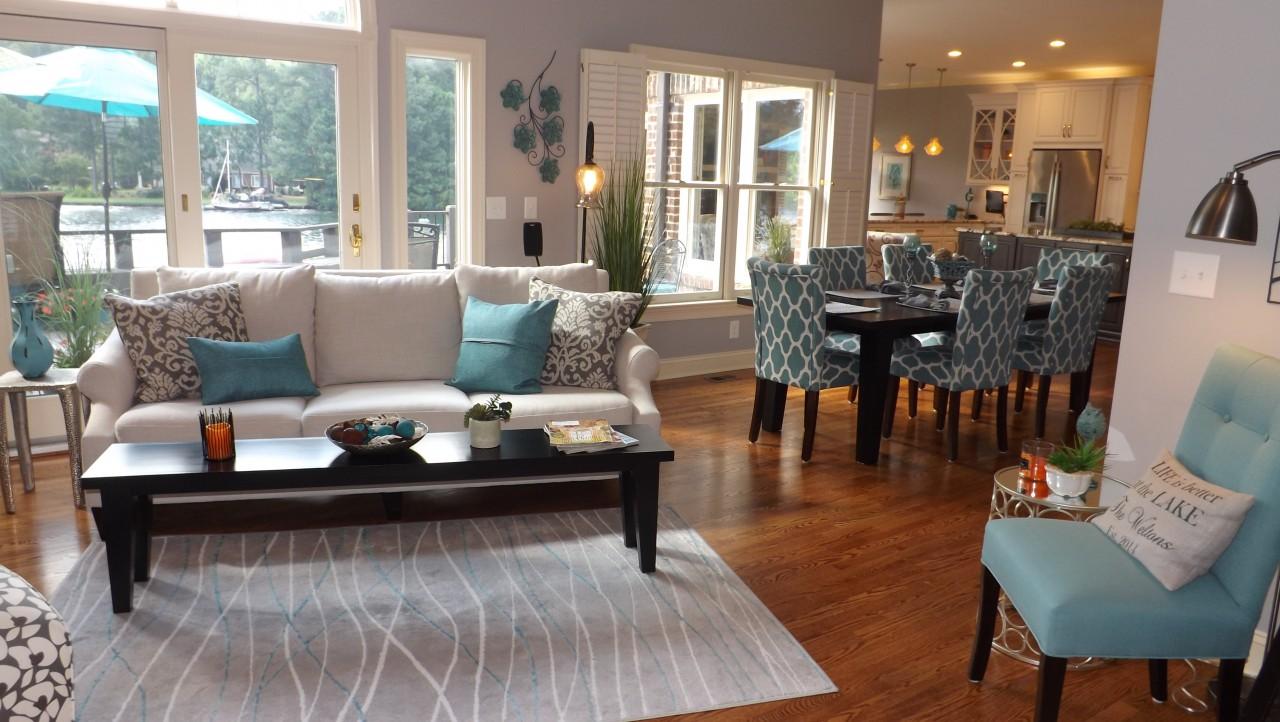 This living room is open to the dining room, and kitchen.