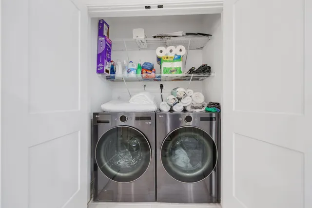 an aerial view of house with yard and ocean view