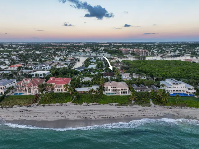 an aerial view of a house with a yard basket ball court and outdoor seating
