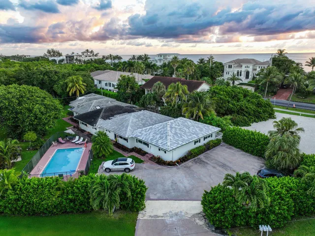 an aerial view of house with yard