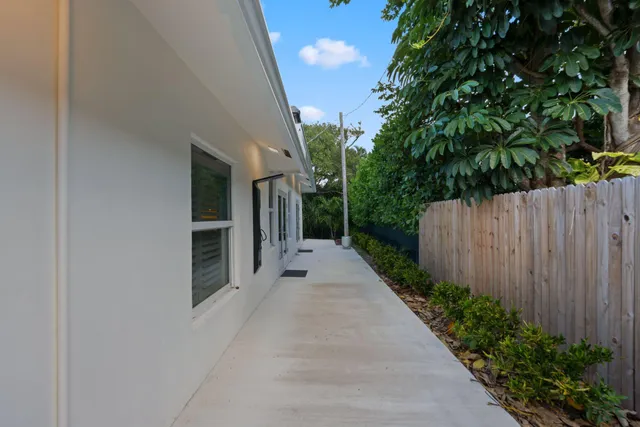 a living room with furniture couches and a large window
