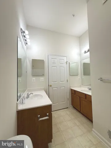 a view of a livingroom with a ceiling fan and window