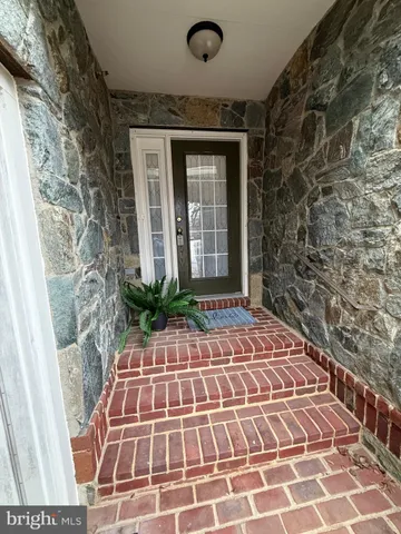 a view of a brick house with many windows