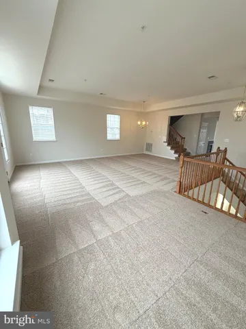 a view of a livingroom with a couch and a fireplace
