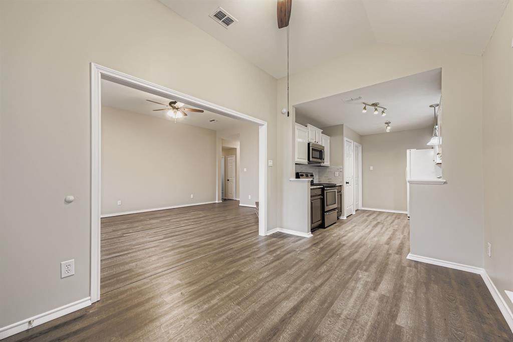 5416 Catlow Valley Road Fort Worth, TX 76137 - Photo 11 of 28 a view of a kitchen with wooden floor a sink and refrigerator