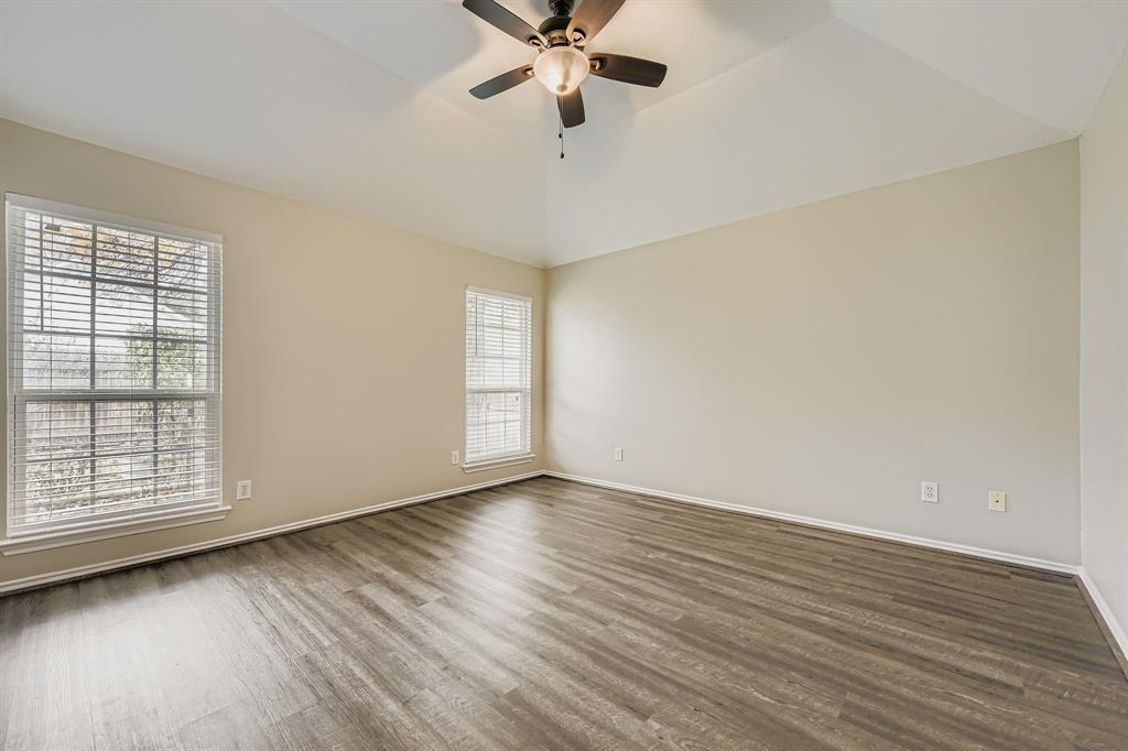 5416 Catlow Valley Road Fort Worth, TX 76137 - Photo 16 of 28 wooden floor in an empty room with a window