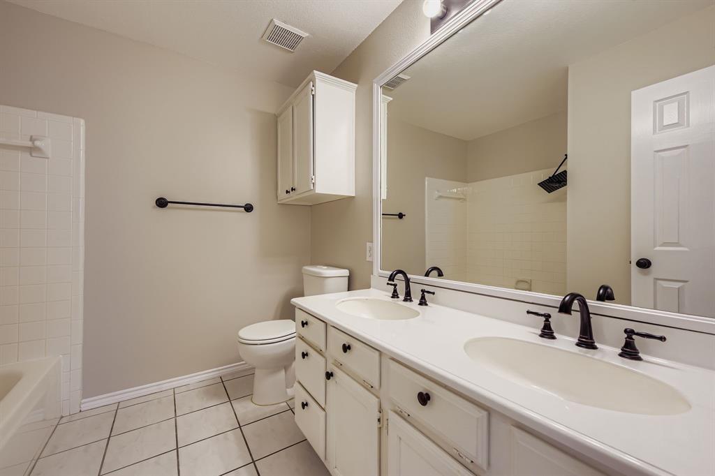 5416 Catlow Valley Road Fort Worth, TX 76137 - Photo 23 of 28 a bathroom with a sink a toilet and mirror