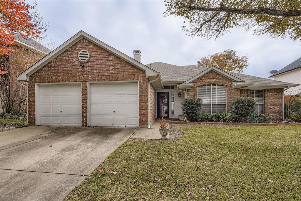 5416 Catlow Valley Road Fort Worth, TX 76137 - Photo 3 of 28 a front view of a house with a yard and garage