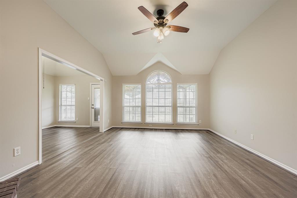 5416 Catlow Valley Road Fort Worth, TX 76137 - Photo 9 of 28 a view of an empty room with a window and wooden floor