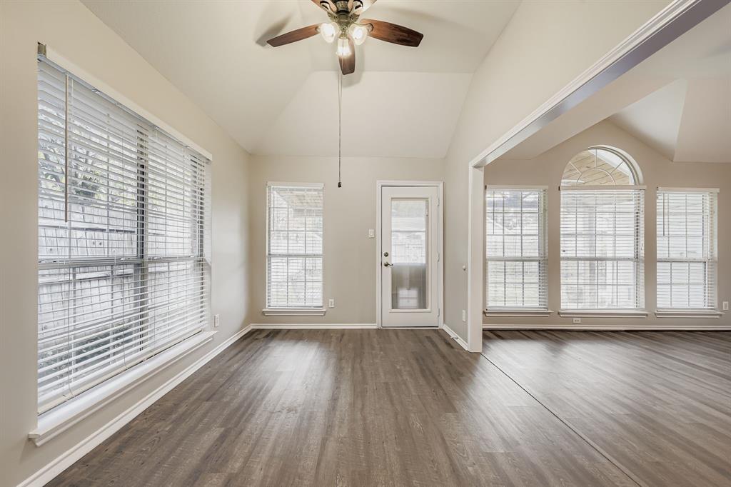 5416 Catlow Valley Road Fort Worth, TX 76137 - Photo 10 of 28 a view of an empty room with wooden floor and a window