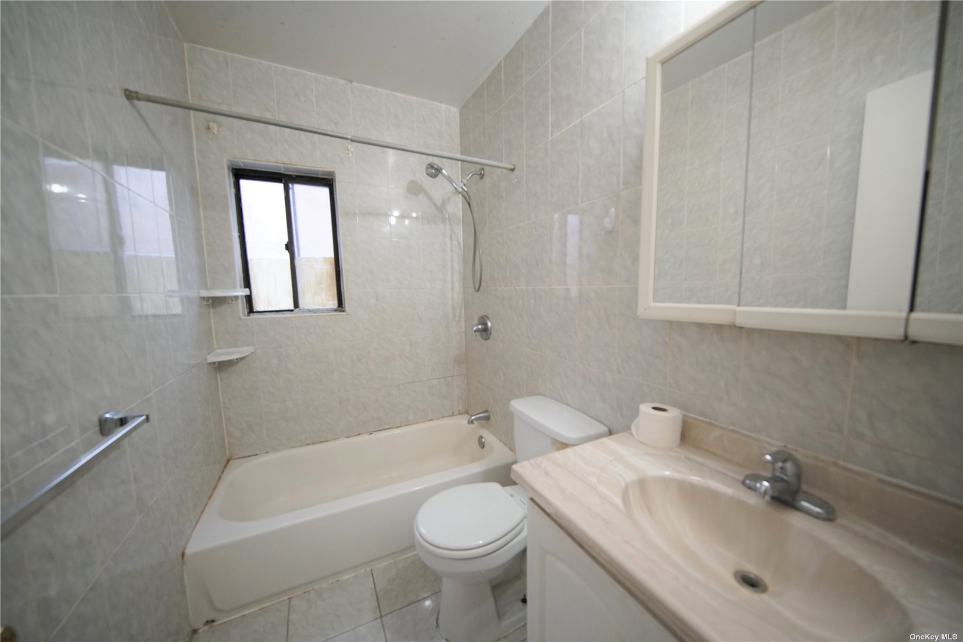 132-56 60th Avenue Queens, NY 11355 - Photo 8 of 8 a bathroom with a sink a toilet and shower