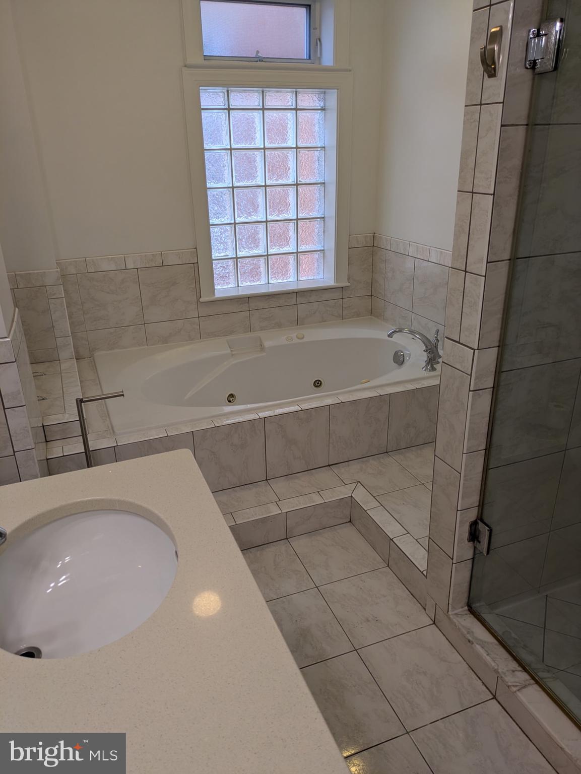 1421 Q Street Northwest, Unit 1 Washington, DC 20009 - Photo 14 of 19 a bathroom with a bathtub
