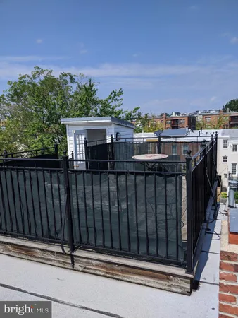 a view of a balcony with city view