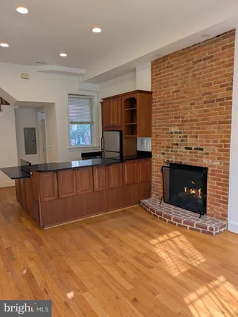 a view of kitchen with furniture and a flat screen tv
