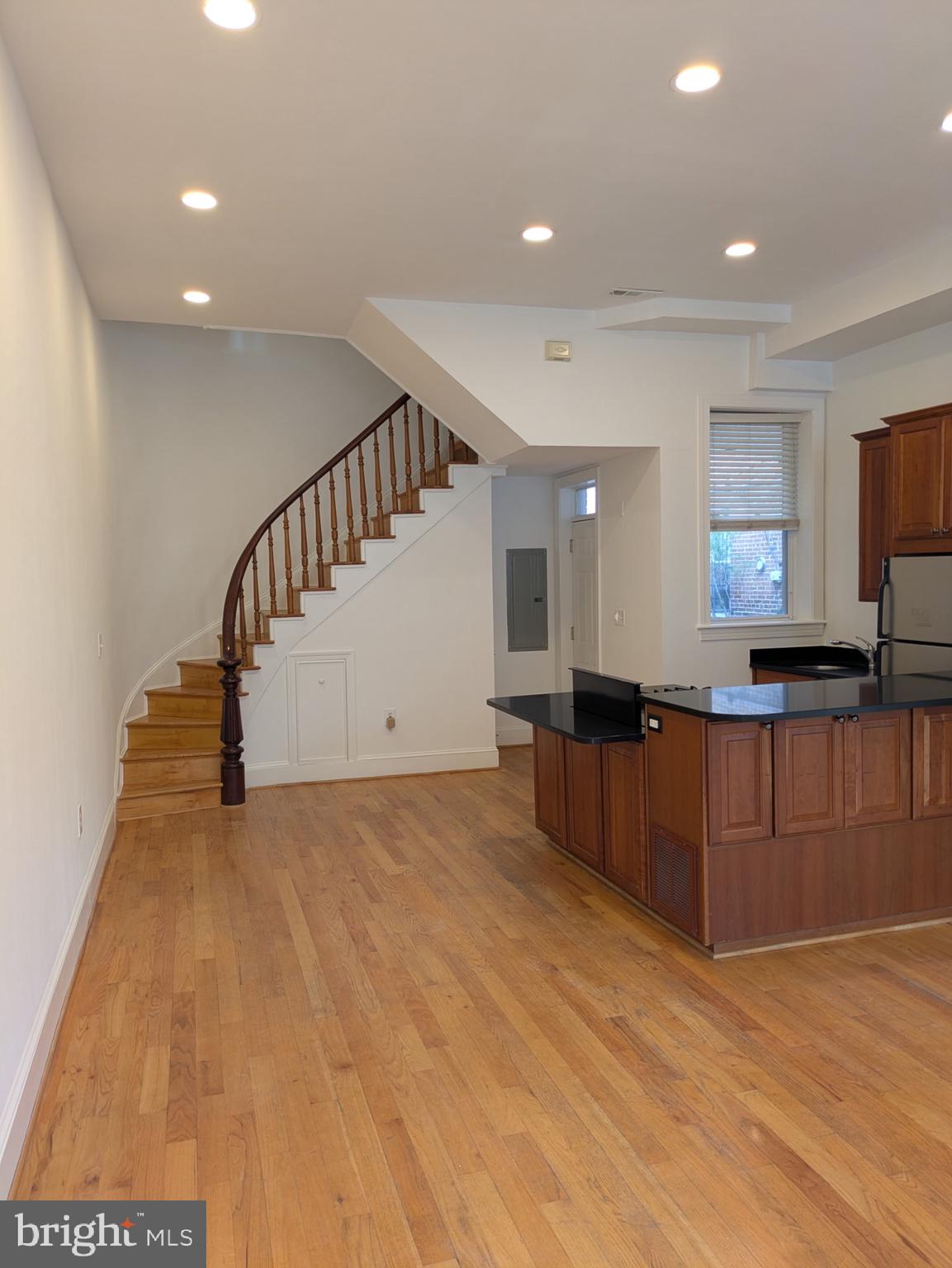 1421 Q Street Northwest, Unit 1 Washington, DC 20009 - Photo 7 of 19 a view of kitchen with furniture and a flat screen tv