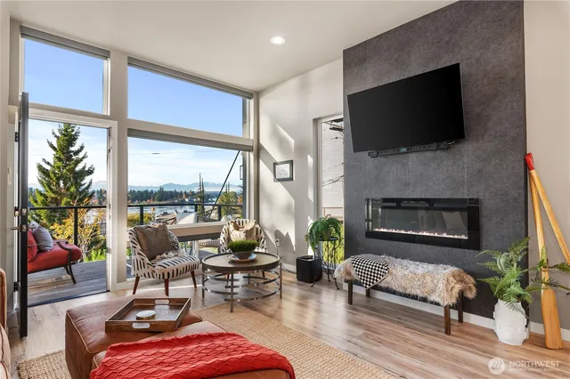 a living room with furniture fireplace and a flat screen tv