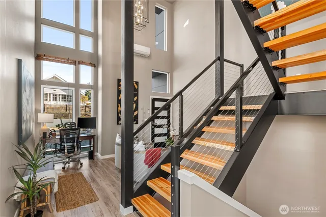 a view of an entryway with wooden floor and furniture