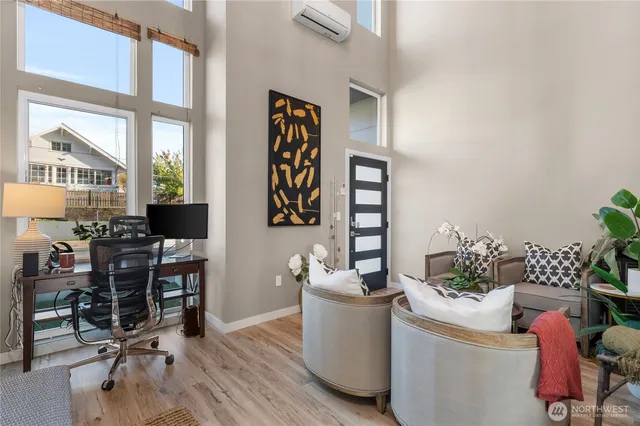 a living room with furniture and flowers