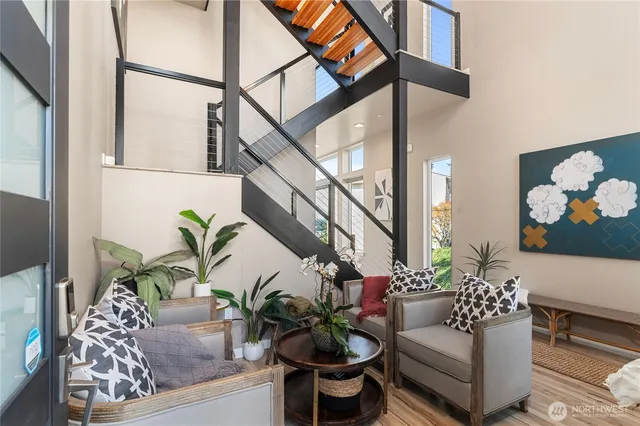 a living room with furniture and a potted plant