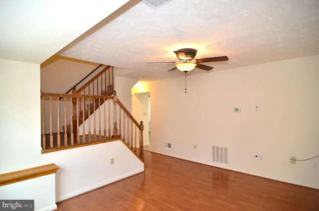 a view of a hallway with stairs